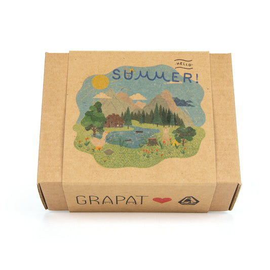 Cardboard box with a summer-themed illustration and 'Grapat' branding on a white background
