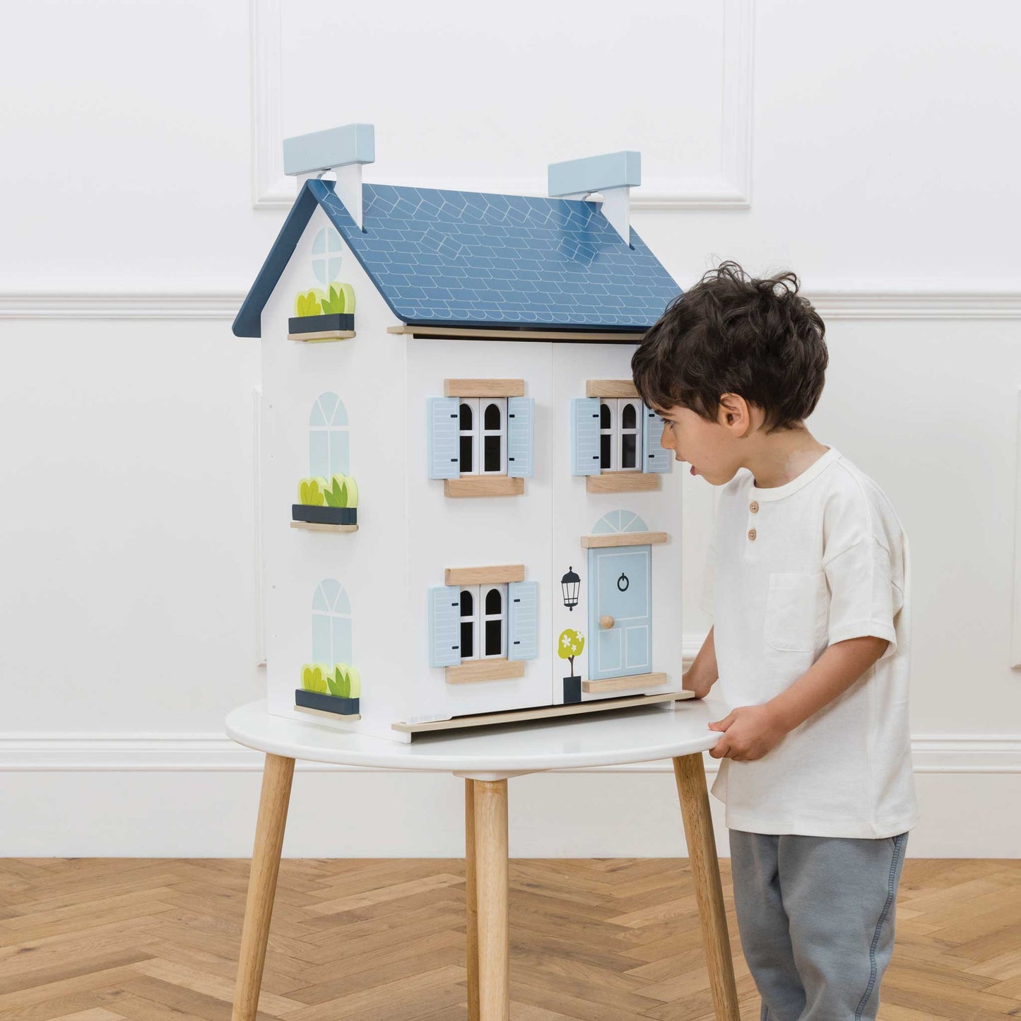 Sky Dolls House, a beautifully crafted wooden dollhouse with multiple rooms from Froglet Toys