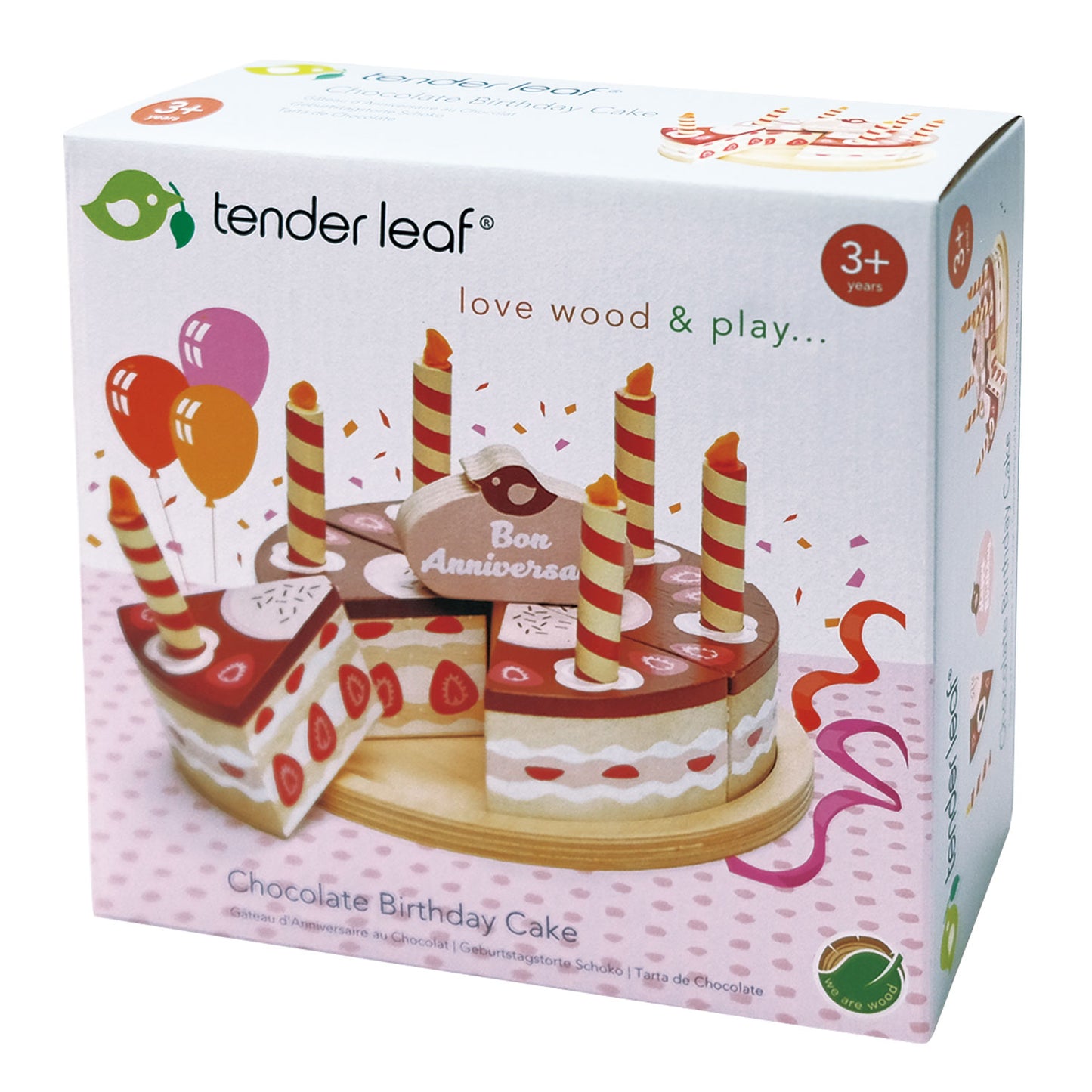 Box containing wooden toy chocolate birthday cake with six candles and a cake topper. The cake divides into six pieces and is presented on a wooden plate.