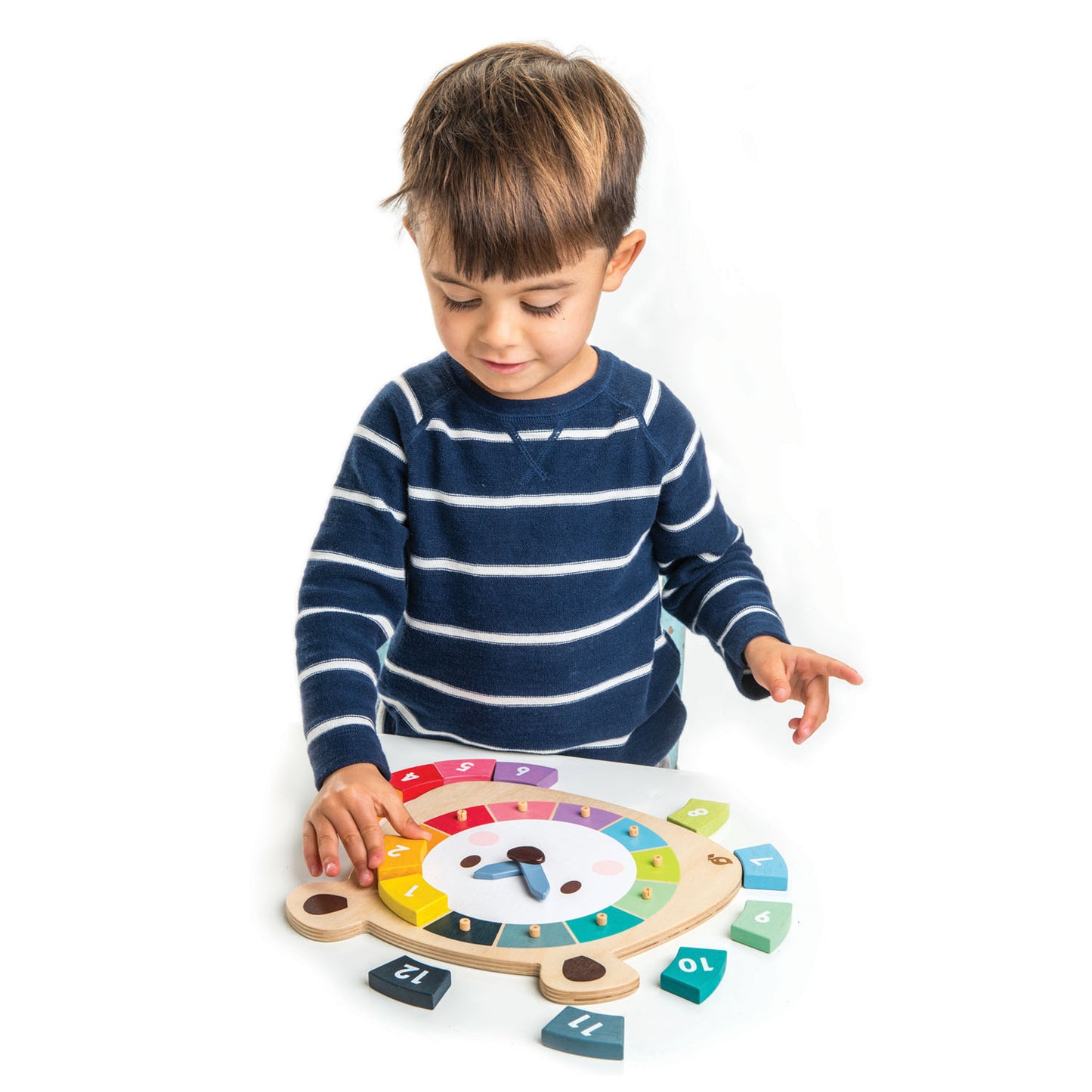 Child playing with wooden bear clock.