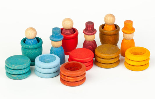 Colorful wooden stacking toys on a white background