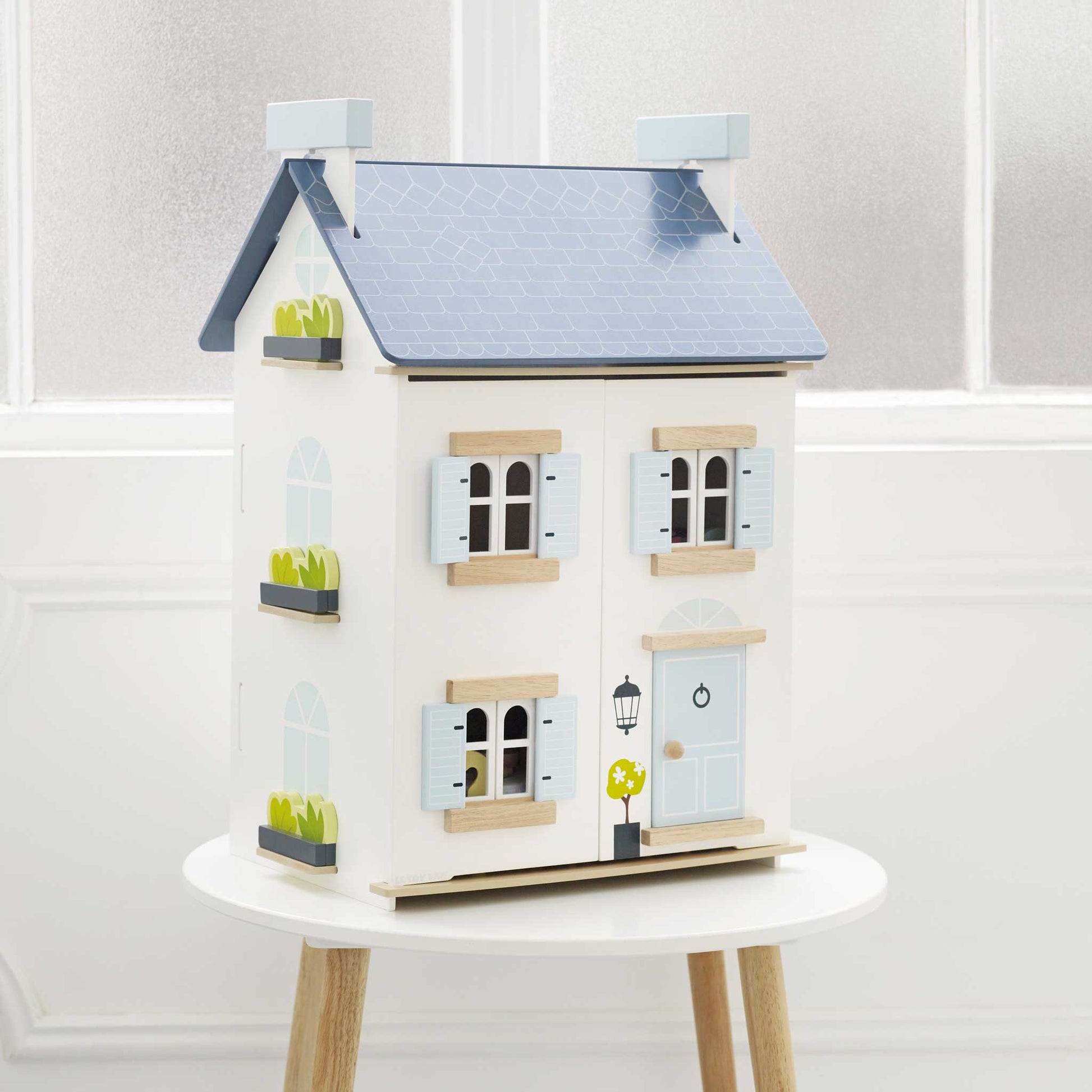 Sky Dolls House, a beautifully crafted wooden dollhouse with multiple rooms from Froglet Toys
