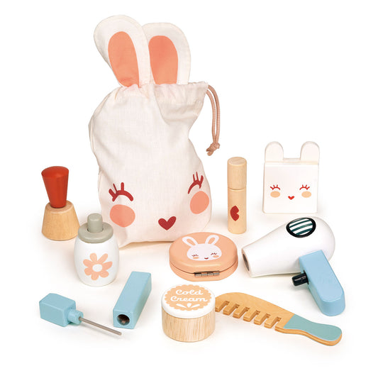 Wooden toy make up set with a bunny theme.  Set includes items such as a lipstick, cream pot, powder puff, hairdryer and comb all in a fabric bag.