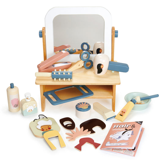 Wooden pretend play hair salon with a table top mirror.  Complete with wooden accessories including brushes, shampoo and scissors.