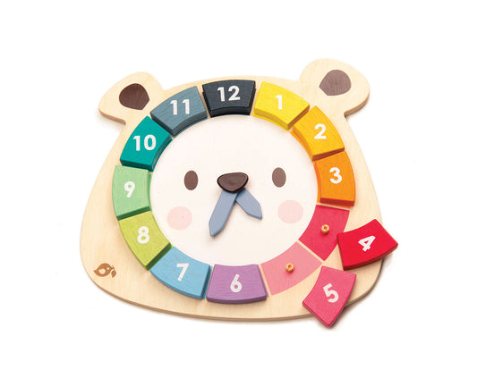 Wooden toy clock with a bear's face.  Removable numbers.
