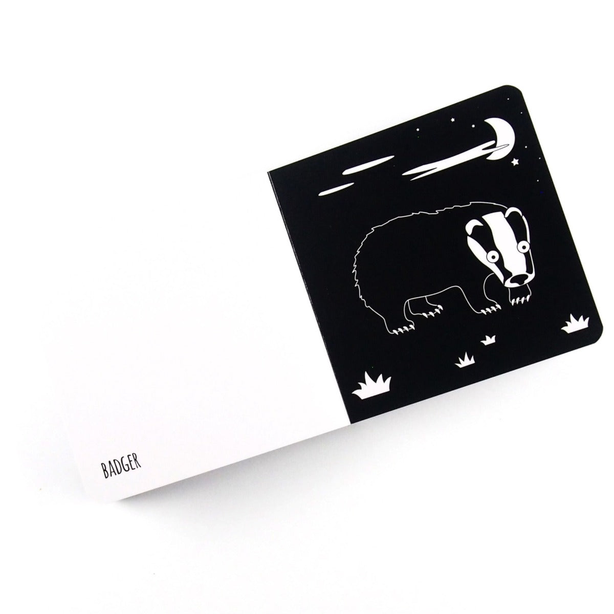 Drawing of a badger with the word on the opposite page from black and white baby board book